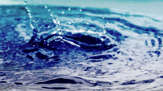 rainwater splashing in a collection barrel